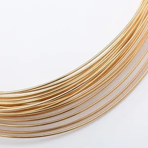 Close-up macro view of 14K gold-filled semi-hard jewelry wire for DIY crafting projects