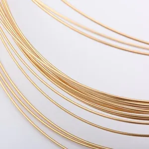 High-quality macro detail of 14k gold-filled jewelry wire showing smooth metallic finish