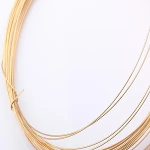 Macro view of high quality 14k gold filled jewelry wire with smooth metallic luster.