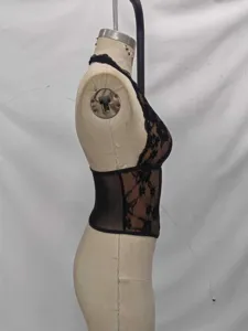 Black lace halter corset top side view showcasing floral pattern and boned waist shaping.