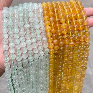Macro detail of natural yellow and green fluorite loose beads for DIY jewelry making