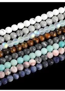 Macro detail of assorted natural stone round beads in various colors for DIY jewelry making