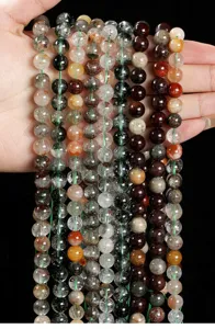 Close-up of multi-colored natural phantom quartz beads for DIY jewelry making