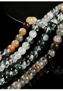 Macro detail of natural phantom quartz loose beads for DIY jewelry making crafts.