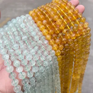 Macro view of natural yellow and pale green translucent fluorite beads for DIY jewelry.