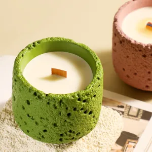 Handcrafted textured scented candle with soy wax and wooden wick for home decor and gifts.