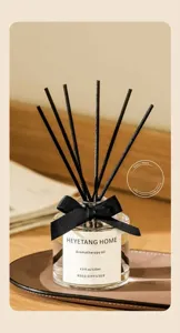 Diffuseur de parfum à bâtonnets avec nœud noir pour maison, hôtel et fraîcheur durable.