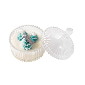 Christmas tree scented candle in ribbed glass jar with lid for festive home decor and gifts.