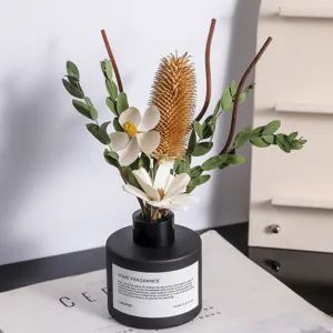 Elegant flameless reed diffuser with dried flower arrangement for home decor and air freshening.
