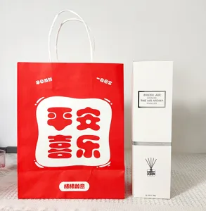 Detail view of the New Year festive aromatherapy gift box set with red bag and white diffuser.