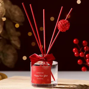 Red reed diffuser gift set with festive new year design, perfect home fragrance decor for room.