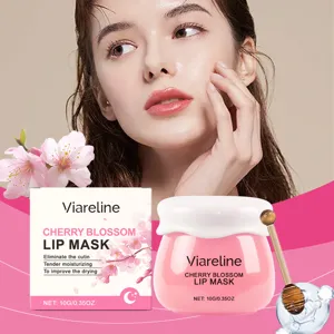 Nahaufnahme Detailansicht von Kirschblüten Lippenmaske Glas und Verpackung mit natürlichem Modell.
