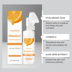Vitamin C facial mousse detail view with natural ingredients and pump brush applicator.