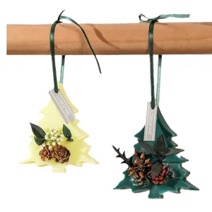 Christmas tree scented wax tablets with dried flowers, pinecones, and hanging ribbon.