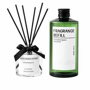 Reed diffuser set with 260ml essential oil refill, decorative glass bottle, and black reeds.