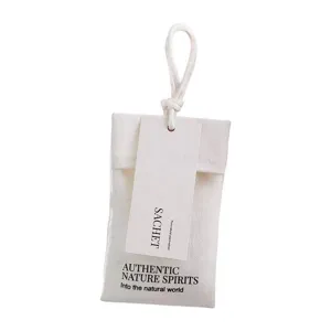 Minimalist white fabric aromatherapy sachet with hanging string for wardrobe and car air fresh.