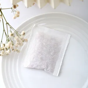 Detailed view of a white fabric wardrobe aromatherapy sachet with natural plant granules for air.