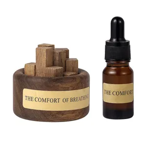 Holz Aroma Diffuser Set mit Tropfflasche und dekorativen Duftoel Holzbloecken.