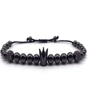 Close-up detail view of the elegant black beaded crown bracelet featuring micro-paved zircon stones.