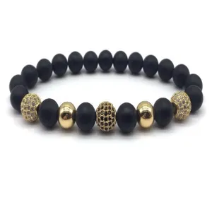 Matte black bead bracelet with gold metal balls and micro pave cubic zirconia beads for men.