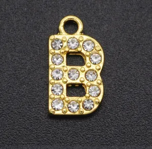 Gold plated rhinestone letter B pendant DIY jewelry accessory, close up detail view.