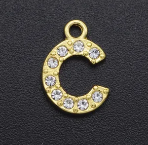 Close-up detail of gold-tone alloy rhinestone letter C charm, sparkling crystal pendant accessory.