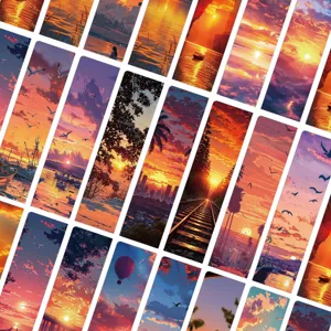 Detalle de marcapáginas de papel con diseño de paisaje de puesta de sol romántica.
