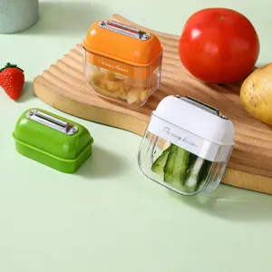 Portable vegetable fruit peeler with storage box, multi-functional stainless steel kitchen tool.