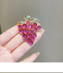 Exquisite purple grape brooch with shiny golden leaves, elegant accessory for women suits.