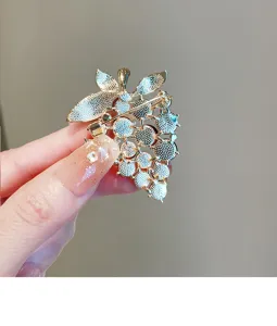 Detailed view of the grape brooch back pin structure, showing sturdy metal clasp mechanism.