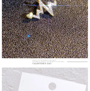 Detailed close-up of a sparkling crystal ECG heart brooch pin, delicate fashion jewelry accessory.
