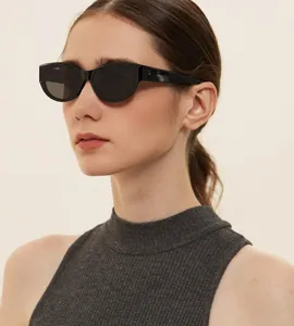 Close-up of stylish black cat eye sunglasses on a female model with vintage vibes