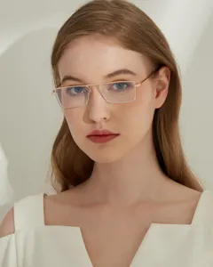 Detailed macro view of stylish golden rectangular metal frame glasses worn by a model
