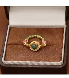 Exquisite close-up of a beaded crystal ring featuring a gold-toned fox head in a brown box