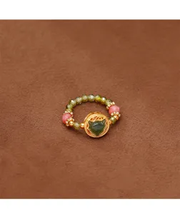 Detail view of New Chinese style beaded ring with gold-tone fox head and green crystals