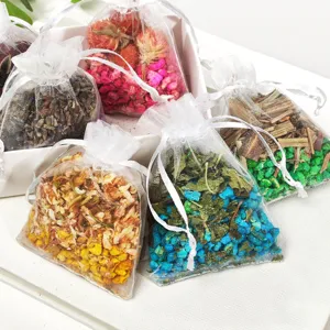 Colorful dried flower scented sachet bags containing plant aromatherapy particles for car use.