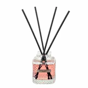 Decorative reed diffuser with pink liquid and black sticks, home fragrance bottle 50ml.