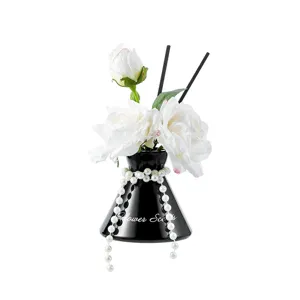 Artificial rose flower aromatherapy black vase ornament detail view for elegant home decor.