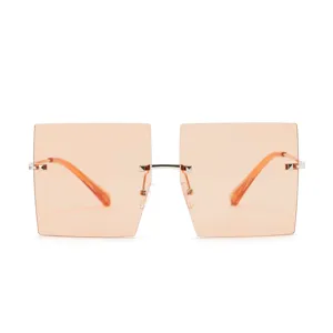 Oversized frameless square sunglasses with champagne orange tinted lenses and silver metal.