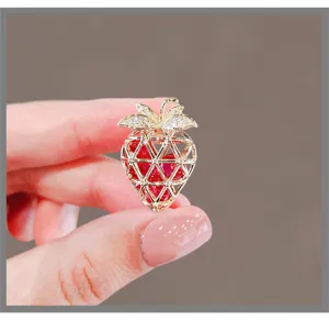 Exquisite strawberry shape brooch detail, elegant suit pin and fashion accessory for women.