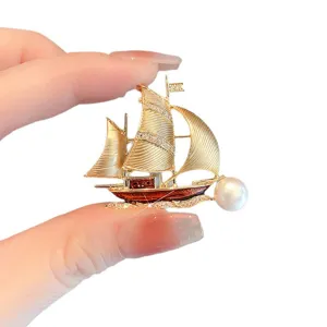 Exquisite gold sailboat lapel pin brooch with pearl and sparkling rhinestones for suits.