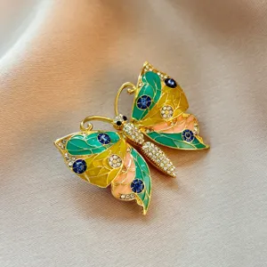 Exquisite butterfly brooch featuring colorful enamel and sparkling rhinestones for elegant women.