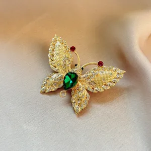 Exquisite green butterfly brooch detailed view, luxury rhinestone crystal pin for women sweaters.