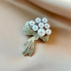 Exquisite pearl rhinestone flower brooch detail showing sparkling crystal craftsmanship.
