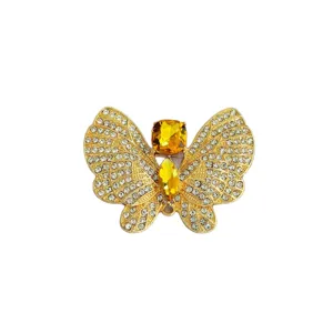 Elegant crystal rhinestone butterfly brooch for women, gold tone suit jacket corsage.