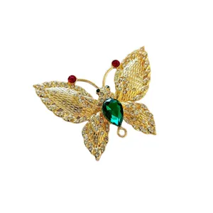Exquisite green rhinestone butterfly brooch for women, luxury crystal corsage pin accessory.