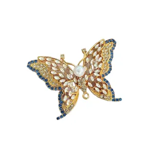 Vintage hollow crystal butterfly brooch for women, elegant suit coat lapel pin accessory.