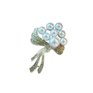 Elegant flower pearl brooch for women, sparkling rhinestone bow corsage pin accessory.