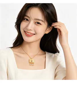 Gold-tone square pendant necklace with evil eye design and cubic zirconia on Asian model