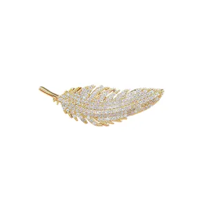 Gold rhinestone feather brooch, elegant crystal lapel pin for suit and dress accessories.